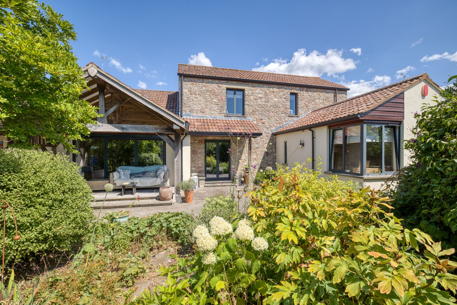 A hidden gem - period barn conversion with secluded gardens and orchard