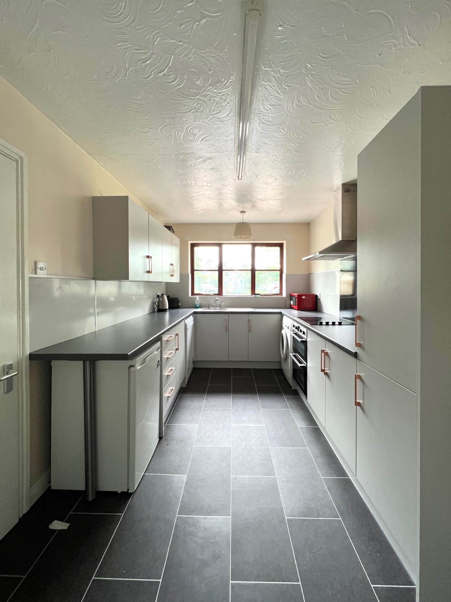 Kitchen with double oven and microwave