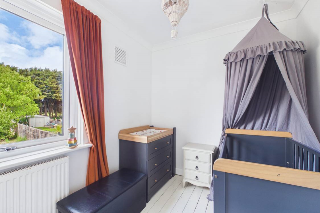Wooden floors in this single bedroom