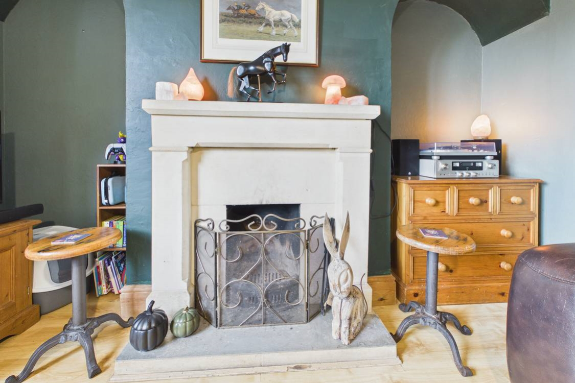 A beautiful fireplace is the focal point of this room