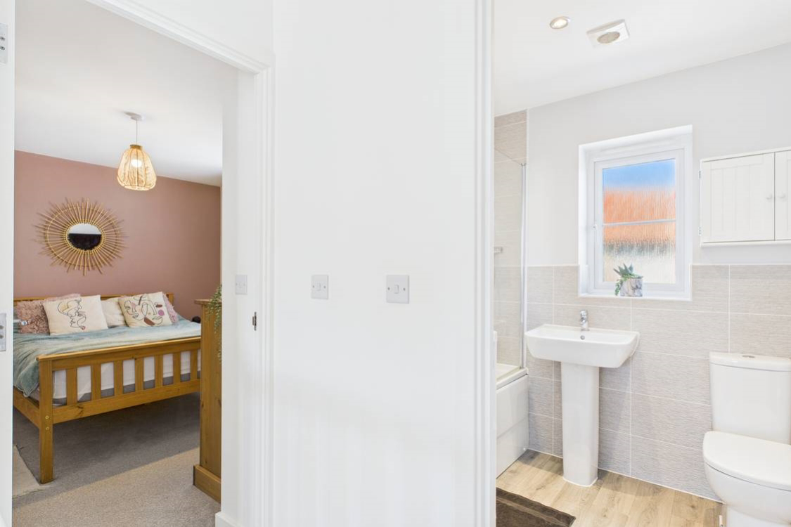 A contemporary designed bathroom emphasizes the modern clean look of the house