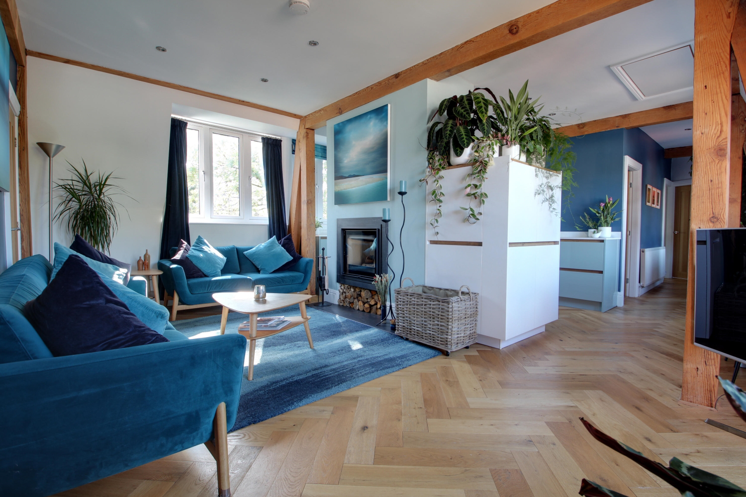 Living room with the kitchen dining and study areas in the background